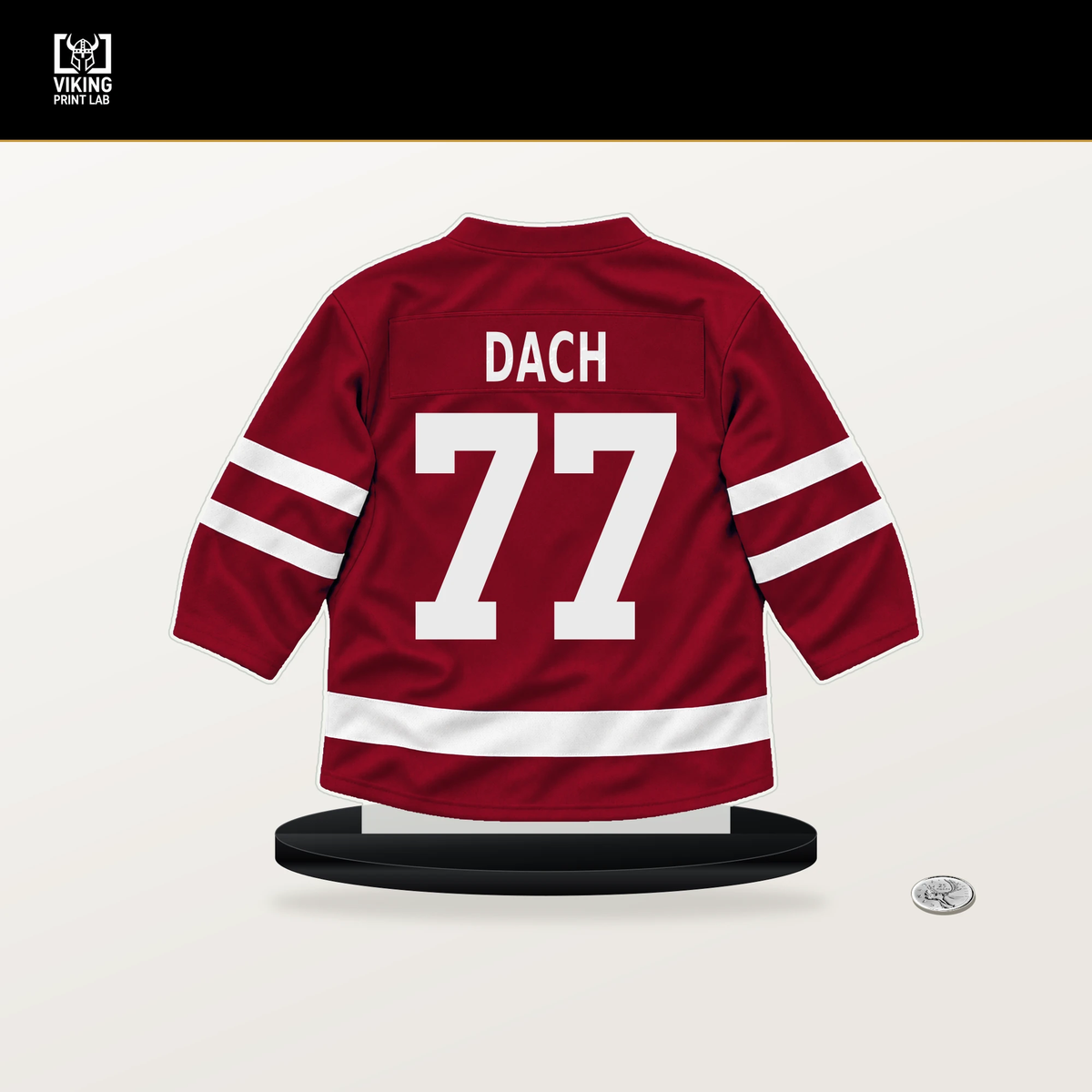Kirby Dach number 77 Montreal Canadiens jersey stand with included black base.