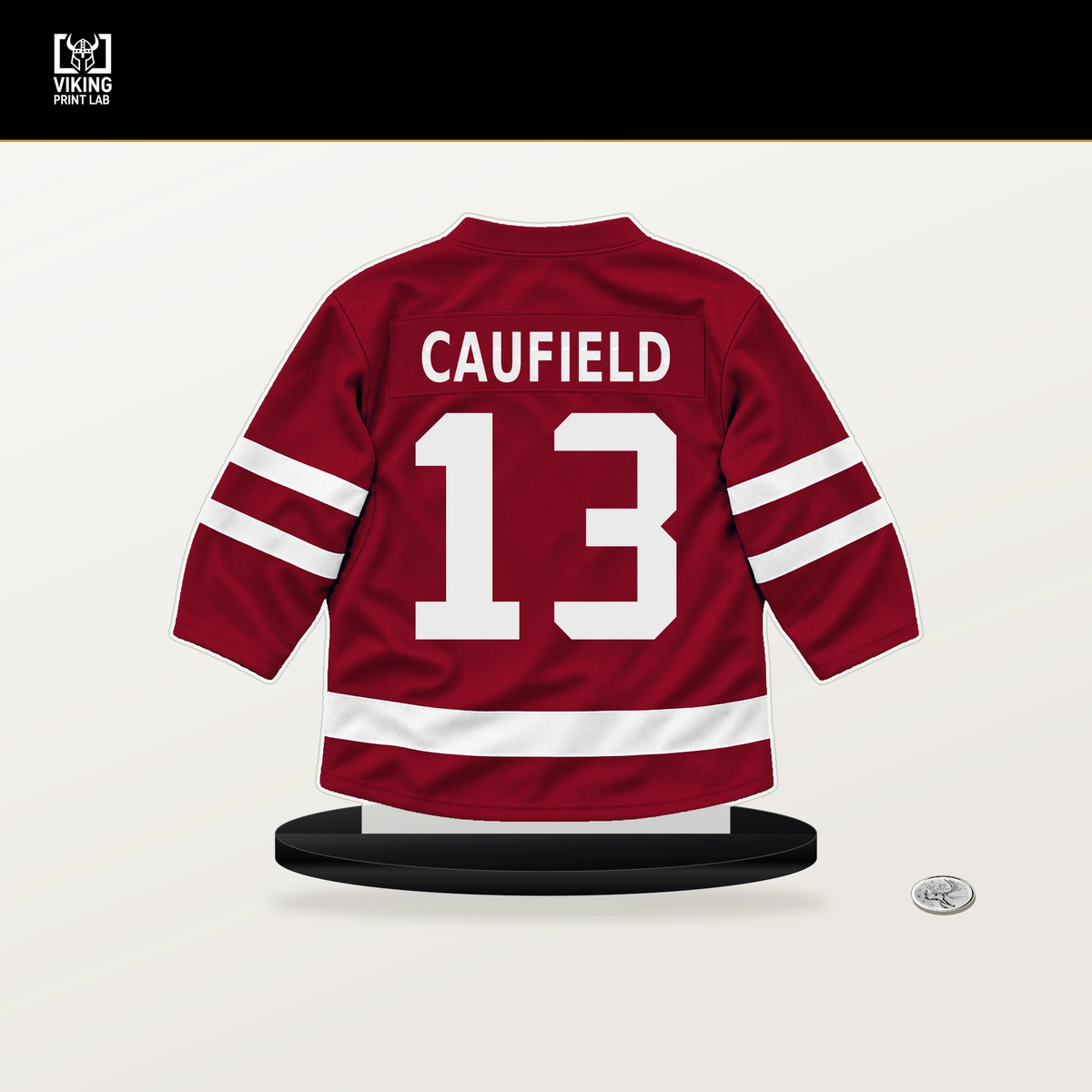 Cole Caufield number 13 Montreal Canadiens jersey stand with included black base.