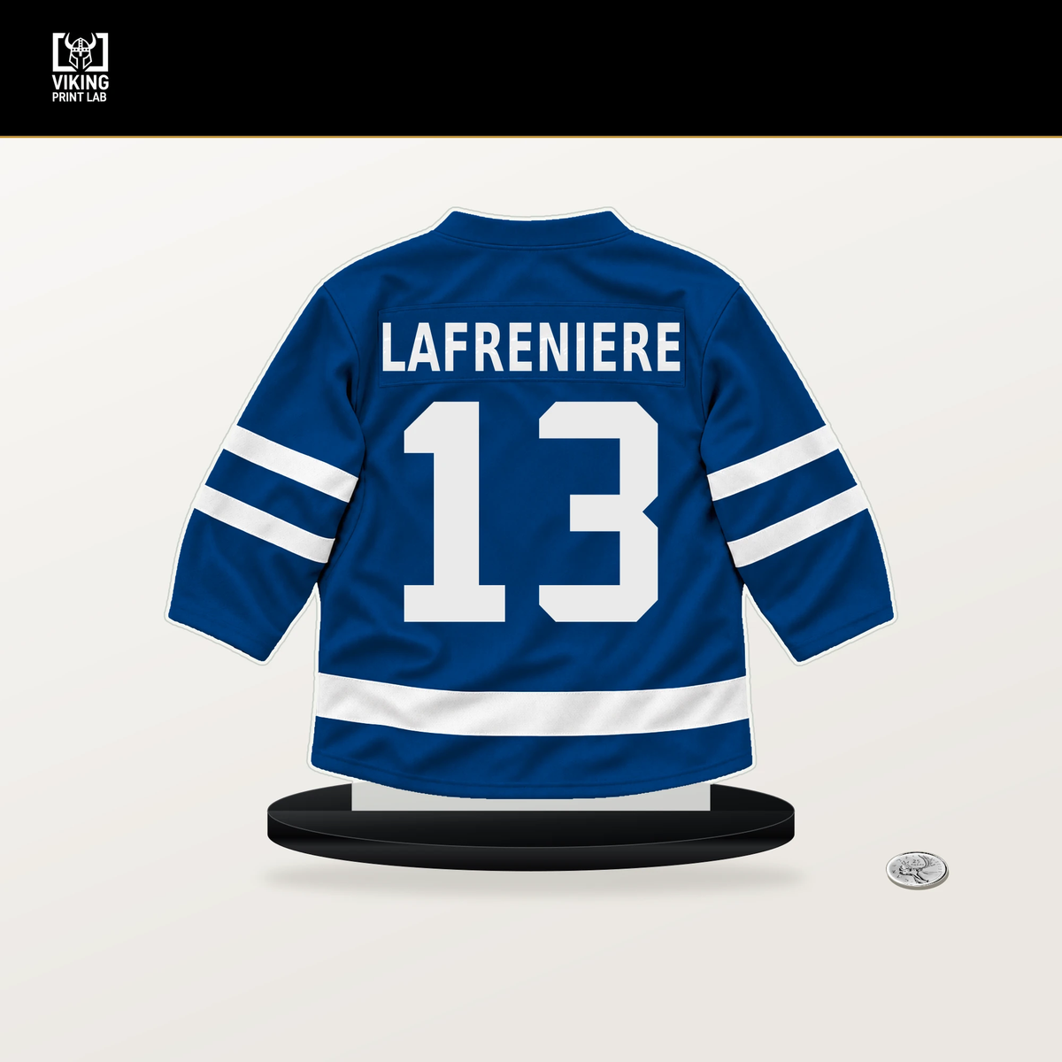 Alexis Lafreniere number 13 New York Rangers jersey stand with included black base.