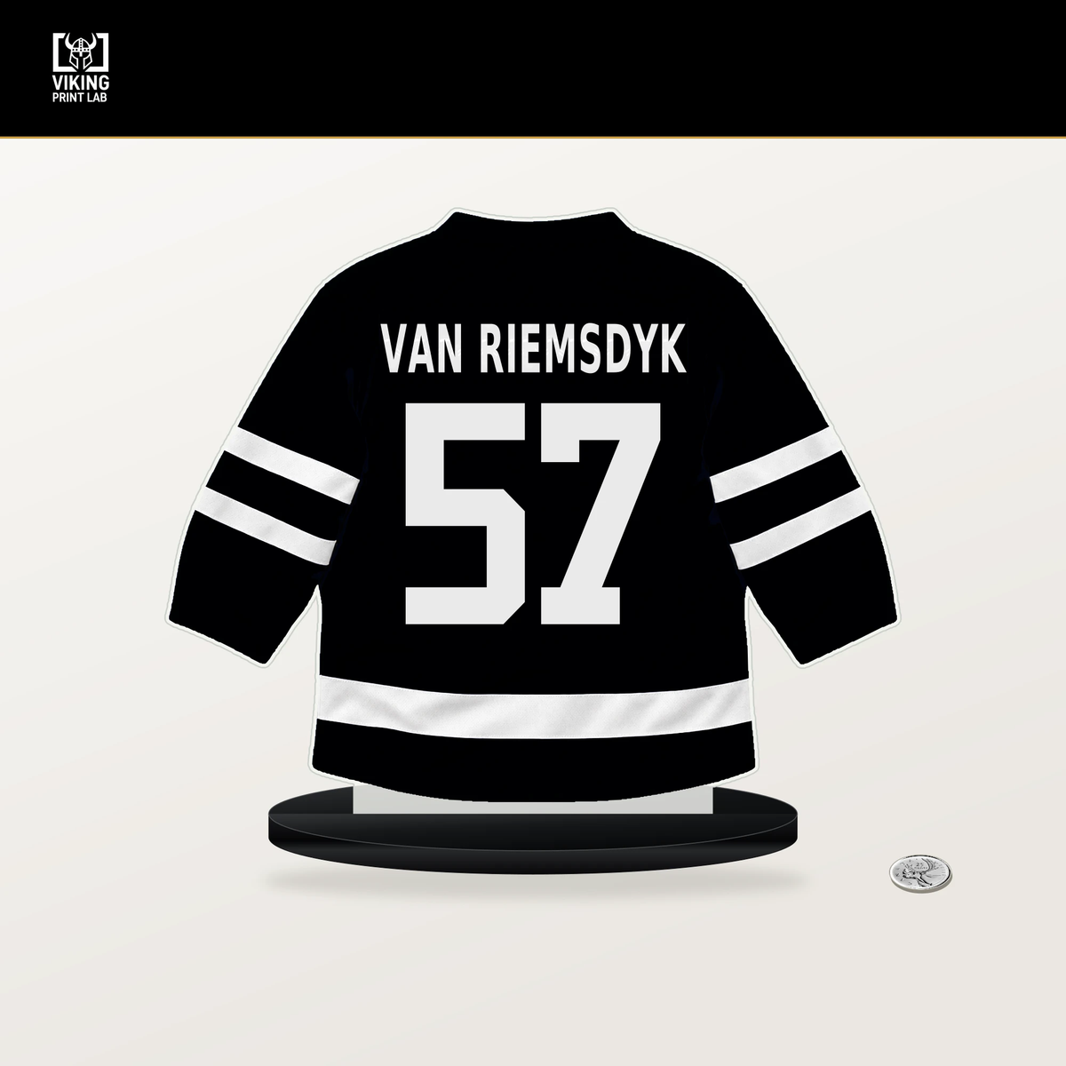Trevor van Riemsdyk number 57 Pittsburgh Penguins jersey stand with included black base.