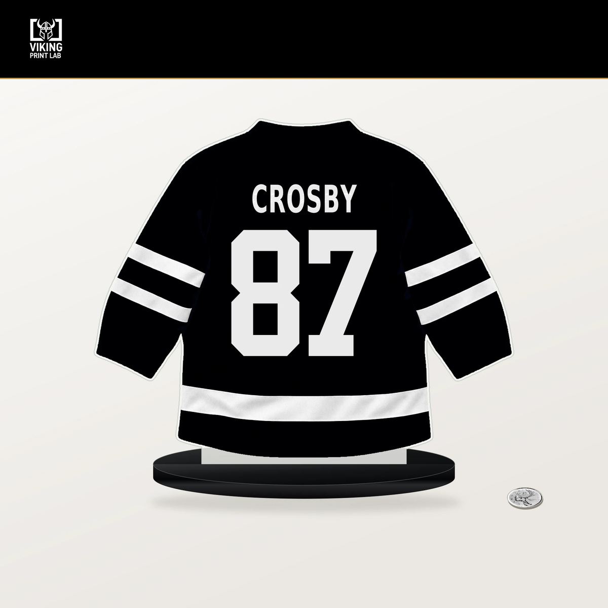 Sidney Crosby number 87 Pittsburgh Penguins jersey stand with included black base.
