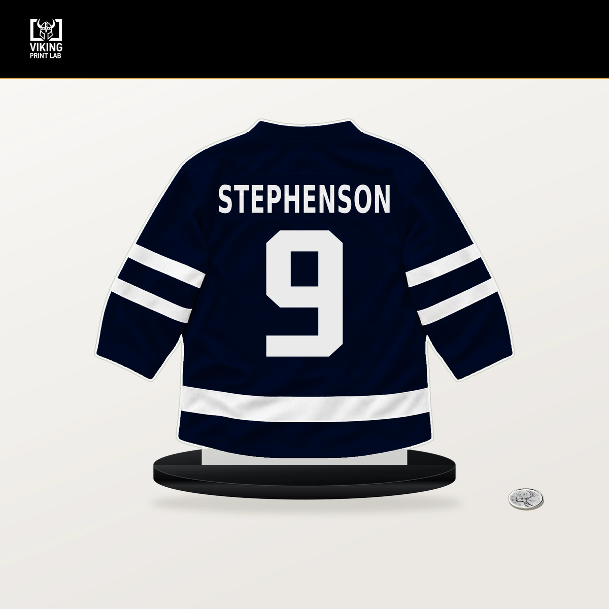 Chandler Stephenson number 9 Seattle Kraken jersey stand with included black base.