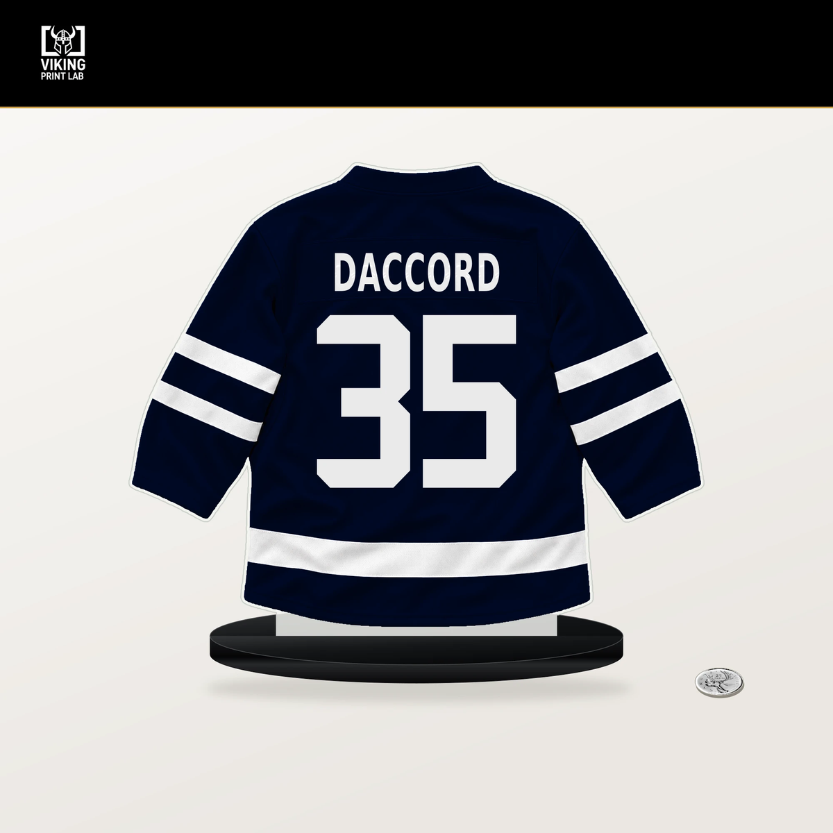 Joey Daccord number 35 Seattle Kraken jersey stand with included black base.