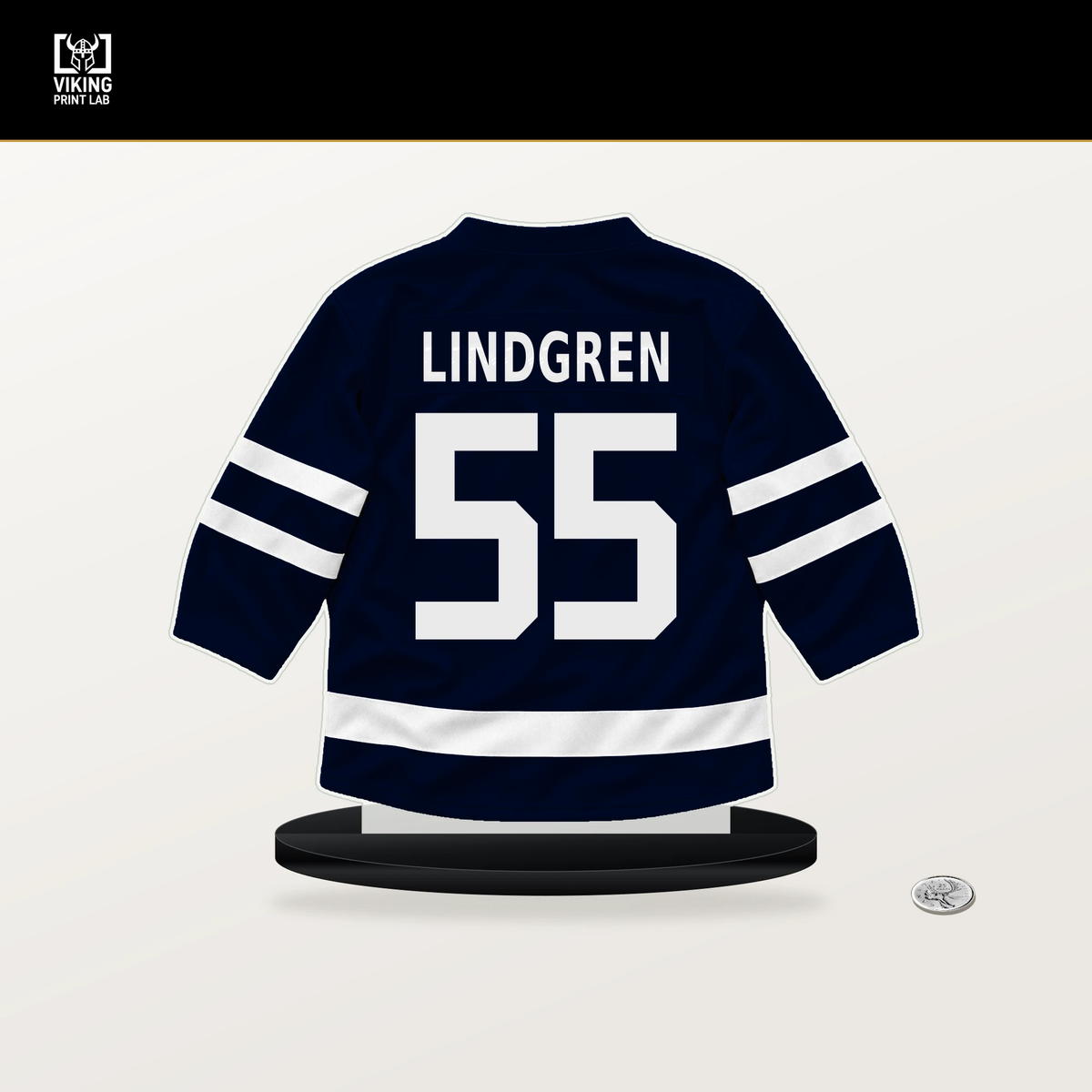Ryan Lindgren number 55 Seattle Kraken jersey stand with included black base.