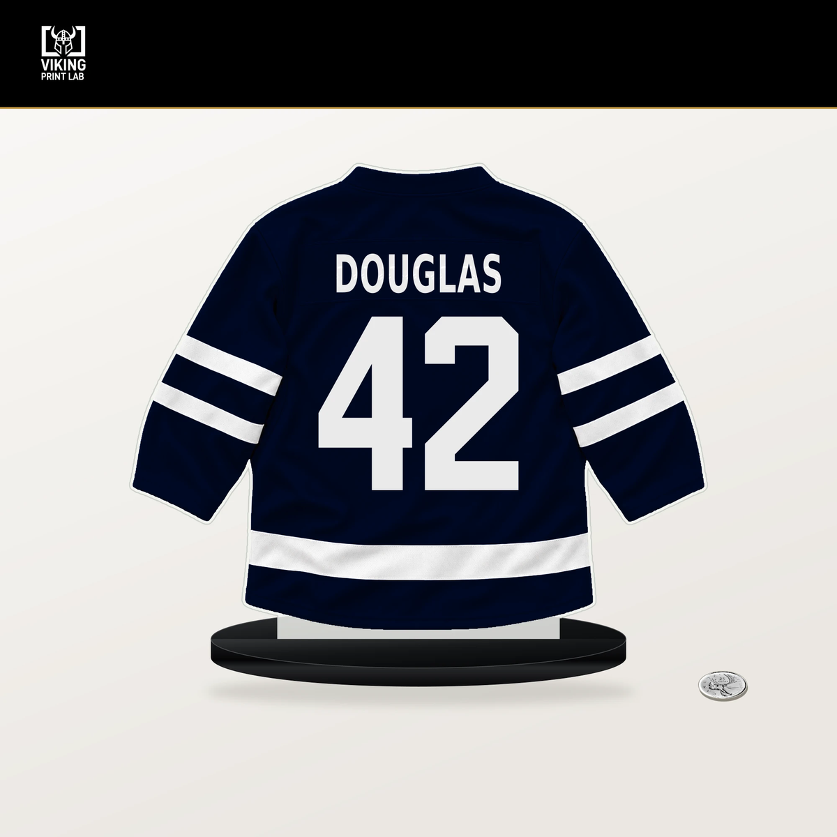Curtis Douglas number 42 Seattle Kraken jersey stand with included black base.