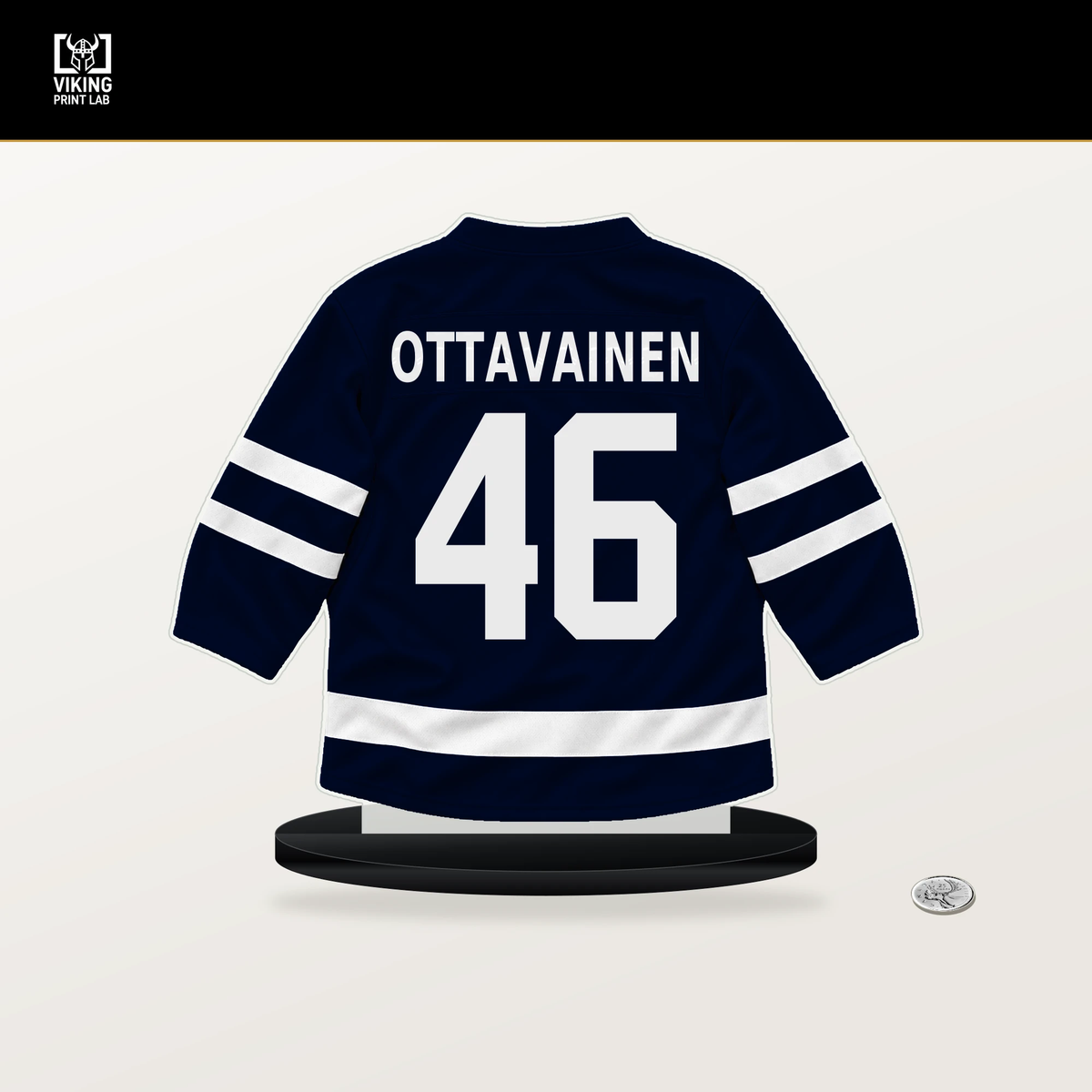 Ville Ottavainen number 46 Seattle Kraken jersey stand with included black base.