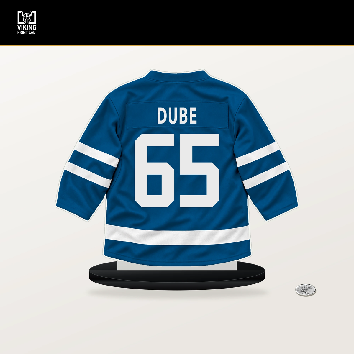 Dillon Dube number 65 St. Louis Blues jersey stand with included black base.
