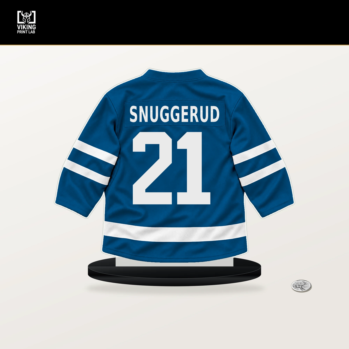 Jimmy Snuggerud number 21 St. Louis Blues jersey stand with included black base.