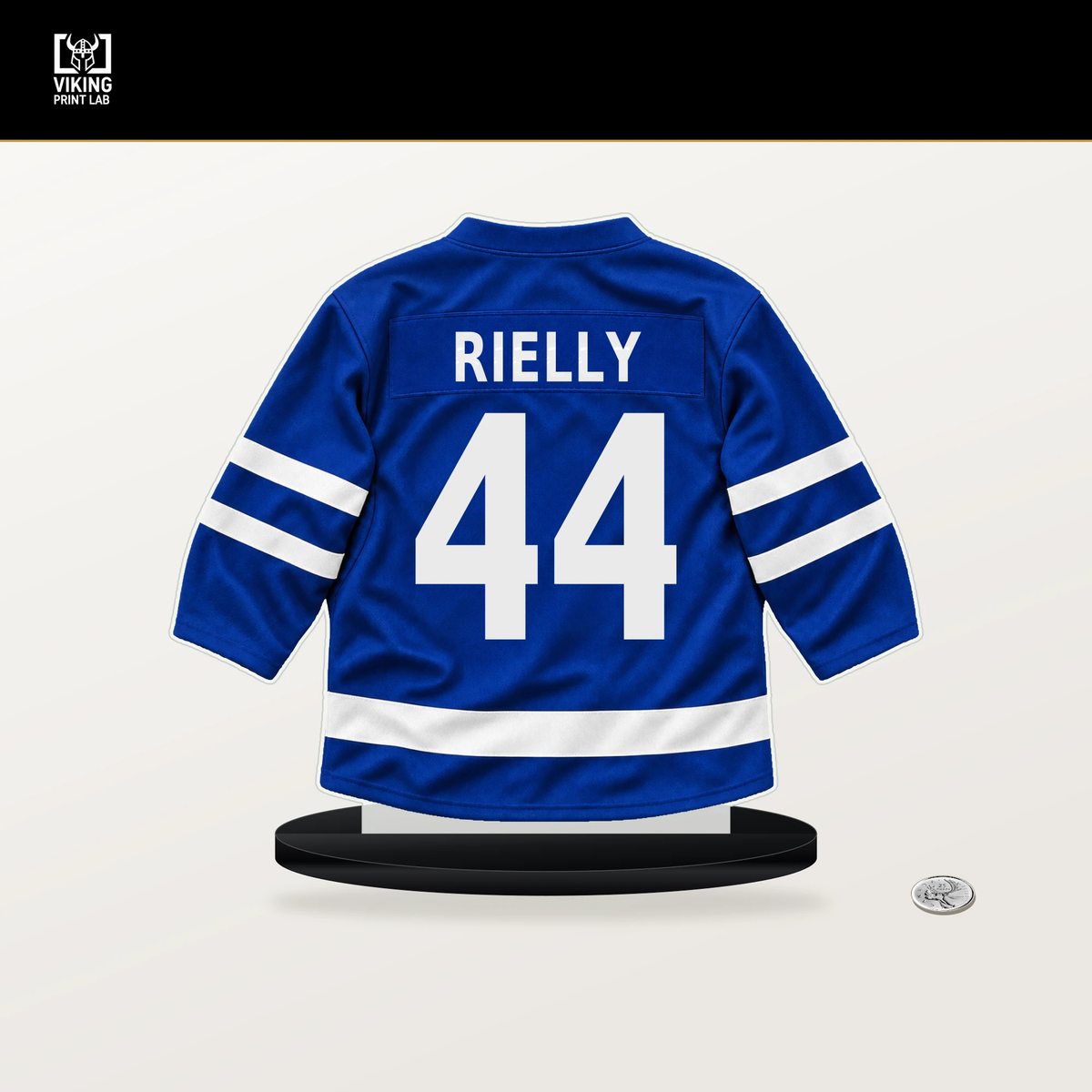 Morgan Rielly number 44 Toronto Maple Leafs jersey stand with included black base.
