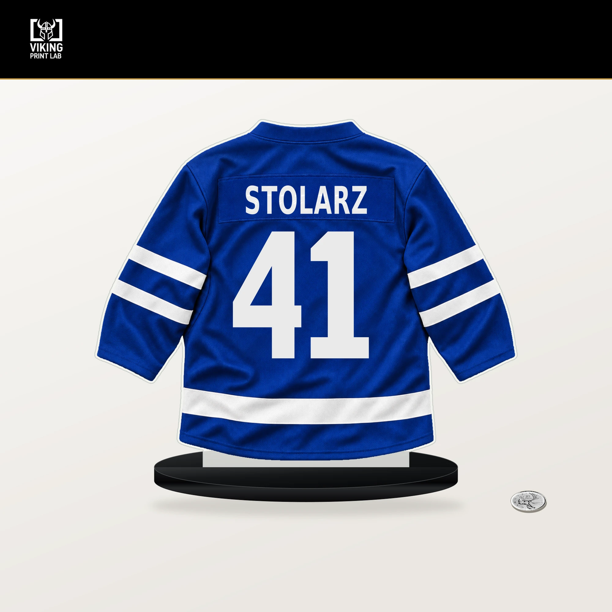 Anthony Stolarz number 41 Toronto Maple Leafs jersey stand with included black base.