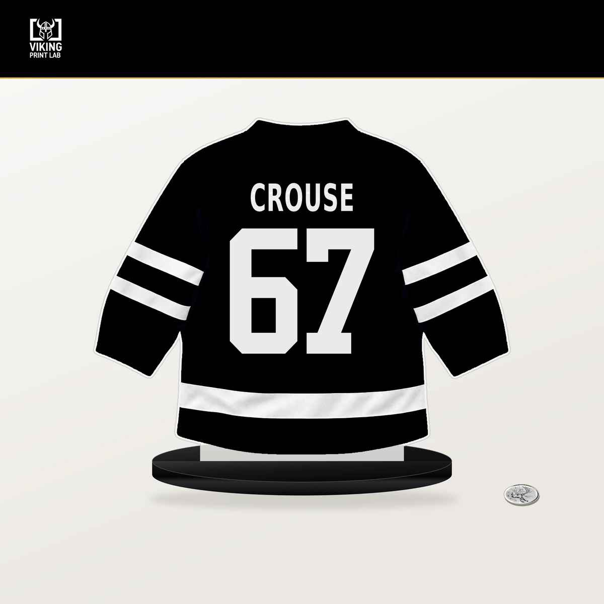 Lawson Crouse number 67 Utah Mammoth jersey stand with included black base.