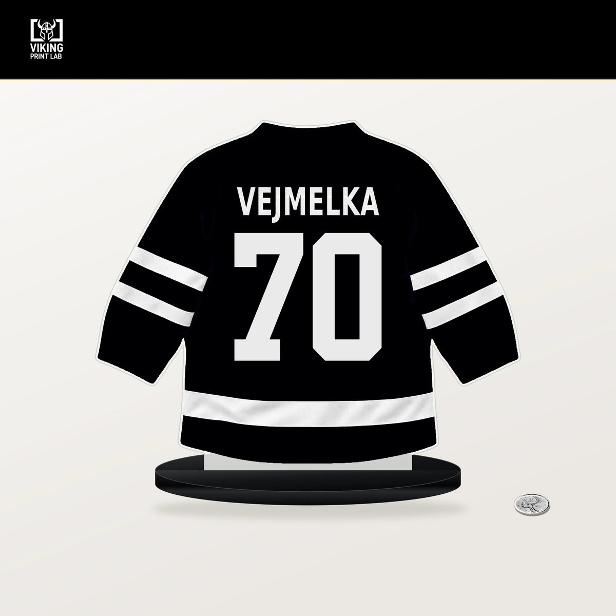 Karel Vejmelka number 70 Utah Mammoth jersey stand with included black base.