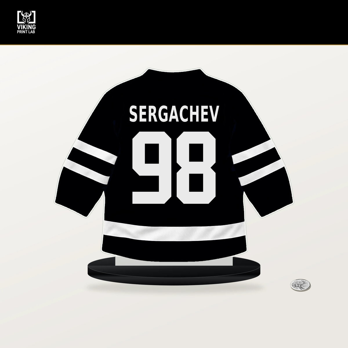 Mikhail Sergachev number 98 Utah Mammoth jersey stand with included black base.