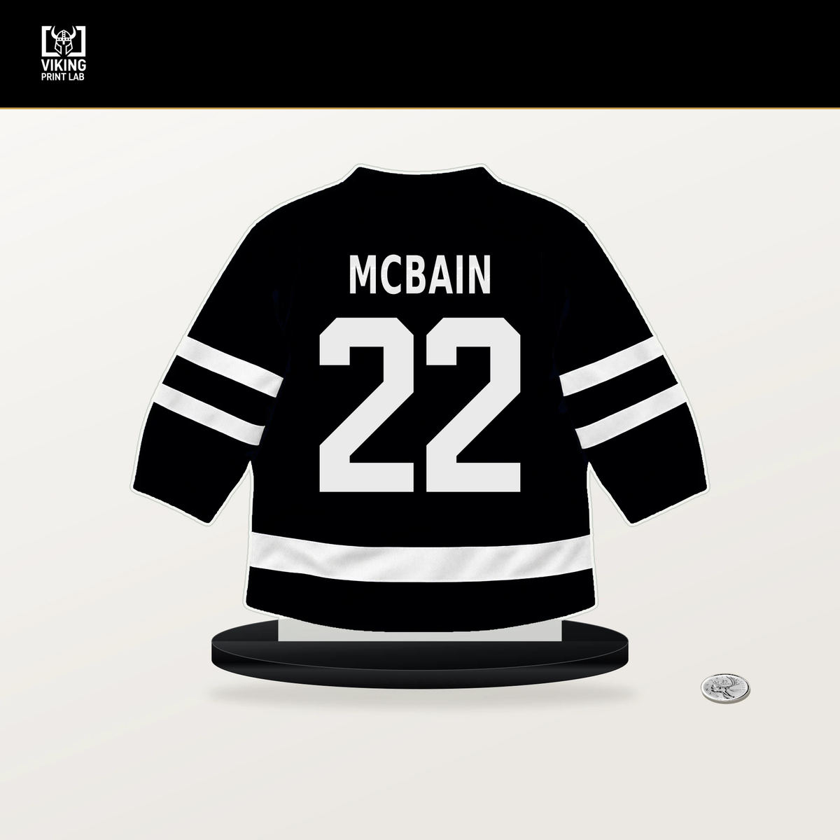 Jack McBain number 22 Utah Mammoth jersey stand with included black base.