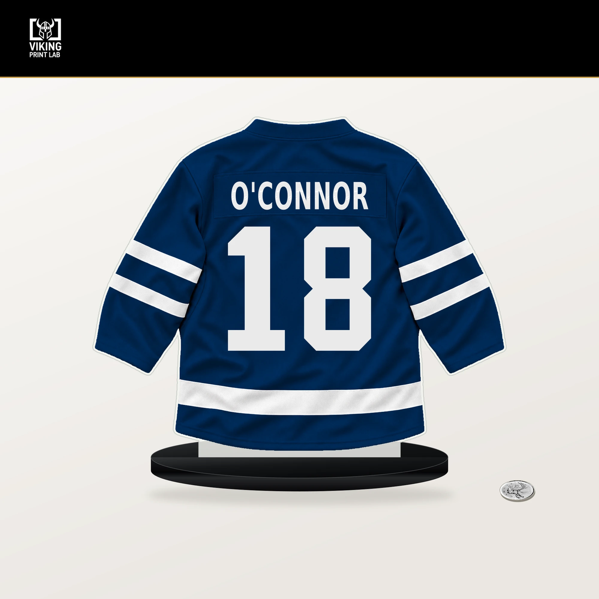 Drew O'Connor number 18 Vancouver Canucks jersey stand with included black base.