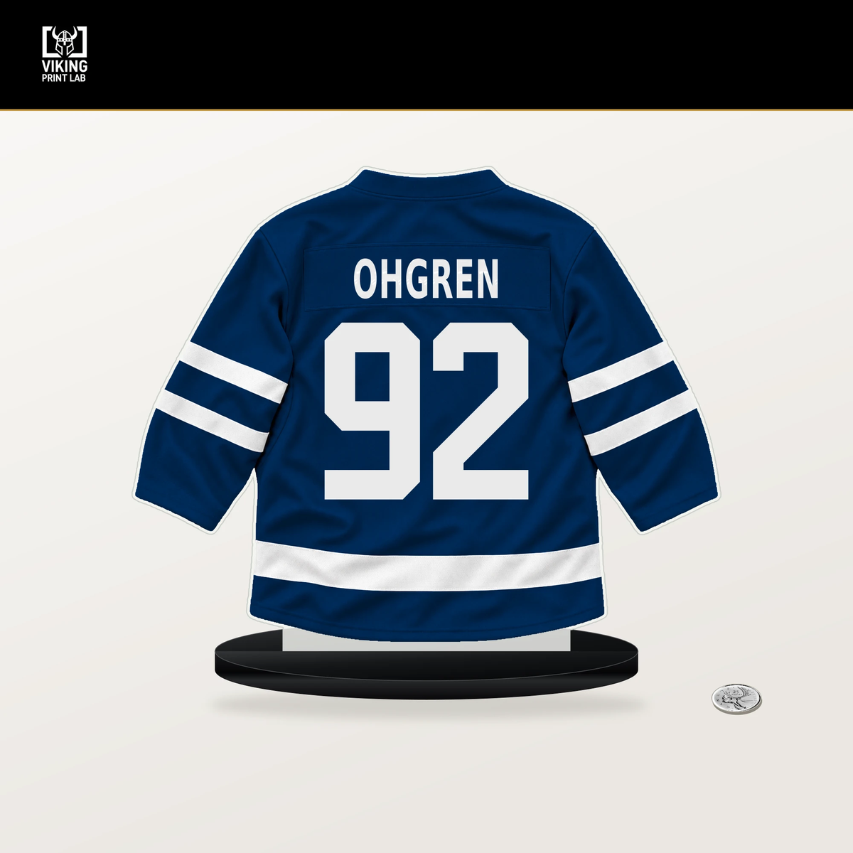 Liam Ohgren number 92 Vancouver Canucks jersey stand with included black base.