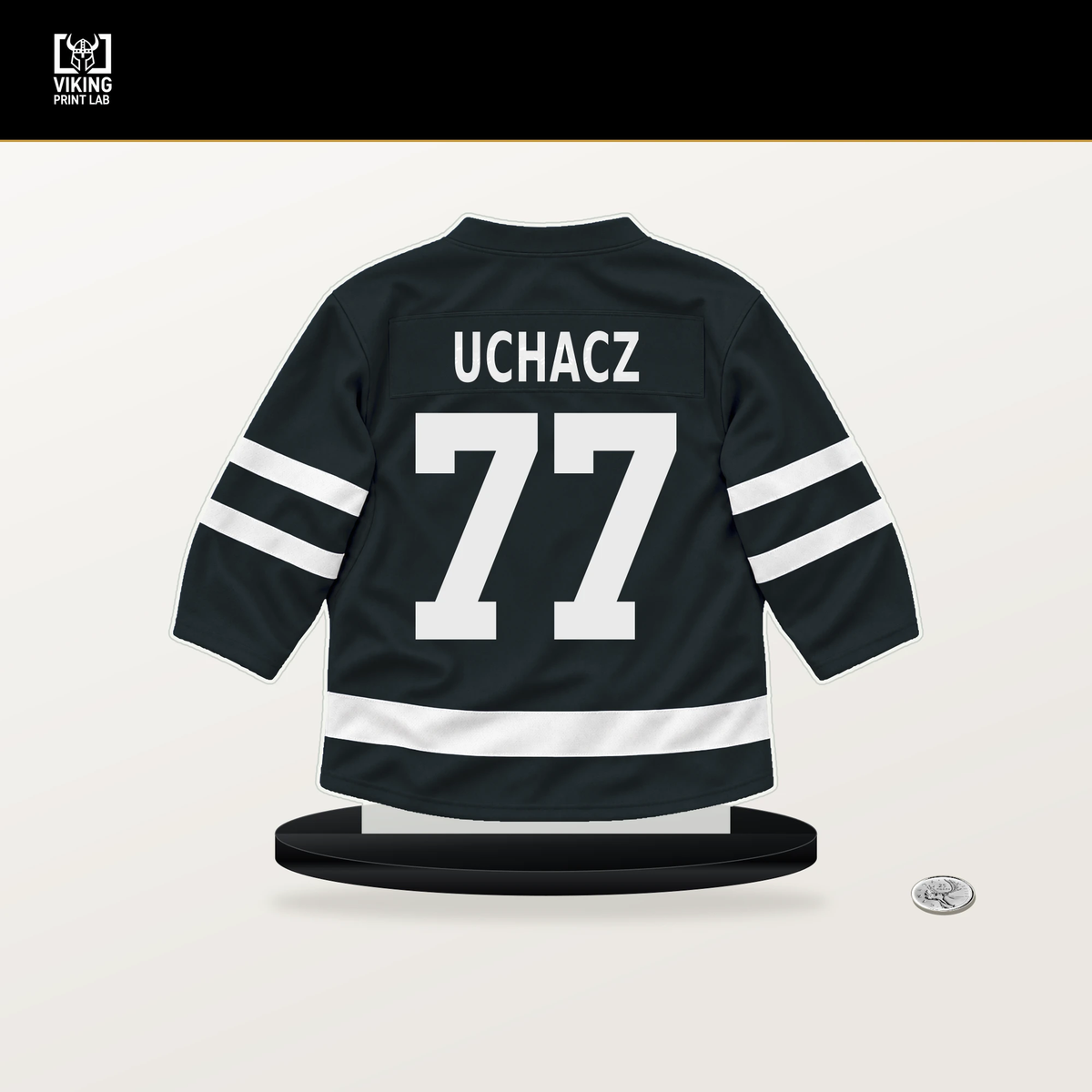 Kai Uchacz number 77 Vegas Golden Knights jersey stand with included black base.