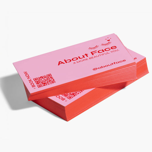Painted-edge business cards with a coral red edge and an example printed design.