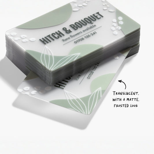 Frosted plastic business card stack showing the semi-transparent material and a design example.