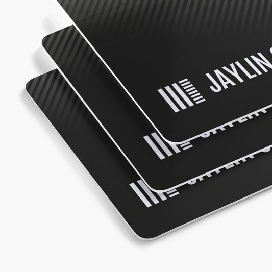 Rounded white plastic business card examples with black printed designs.