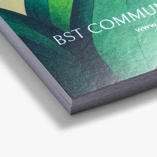 Close-up of Premium Plus business card paper with a printed design example.
