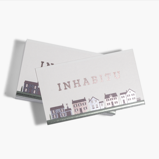 Metallic foil accent business card examples for a real-estate business.