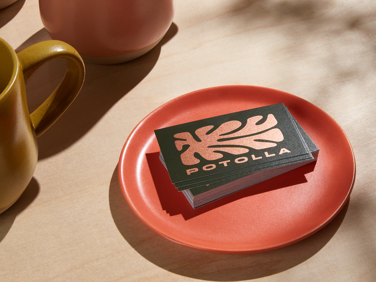 Copper-coloured flat foil accent example on a dark business card.