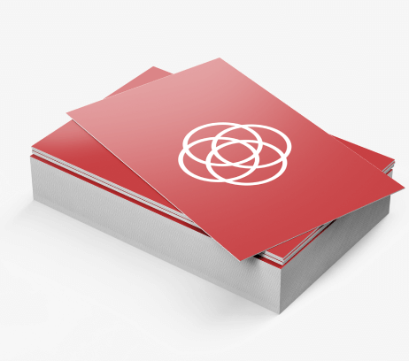 Sample silk-laminated business cards with a red printed design.