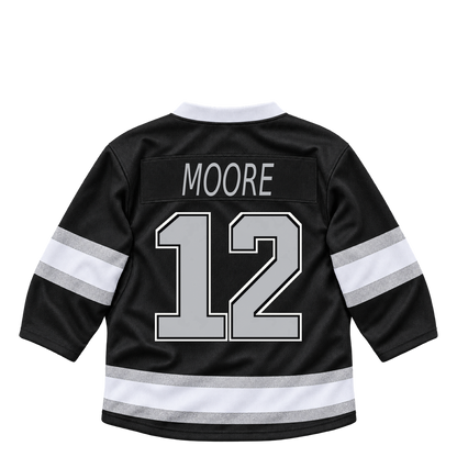 Los Angeles Kings jersey keychain — Trevor Moore #12. Exact saved player artwork preview.