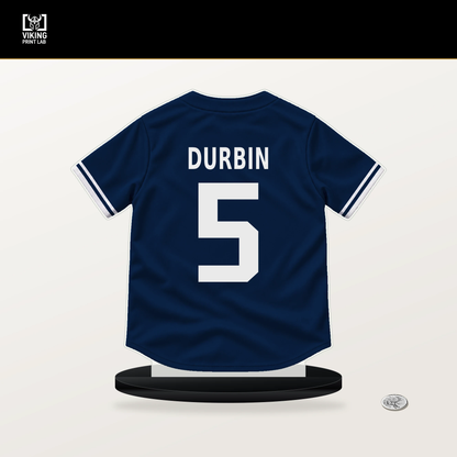 Caleb Durbin number 5 Boston Red Sox jersey stand with included black base.