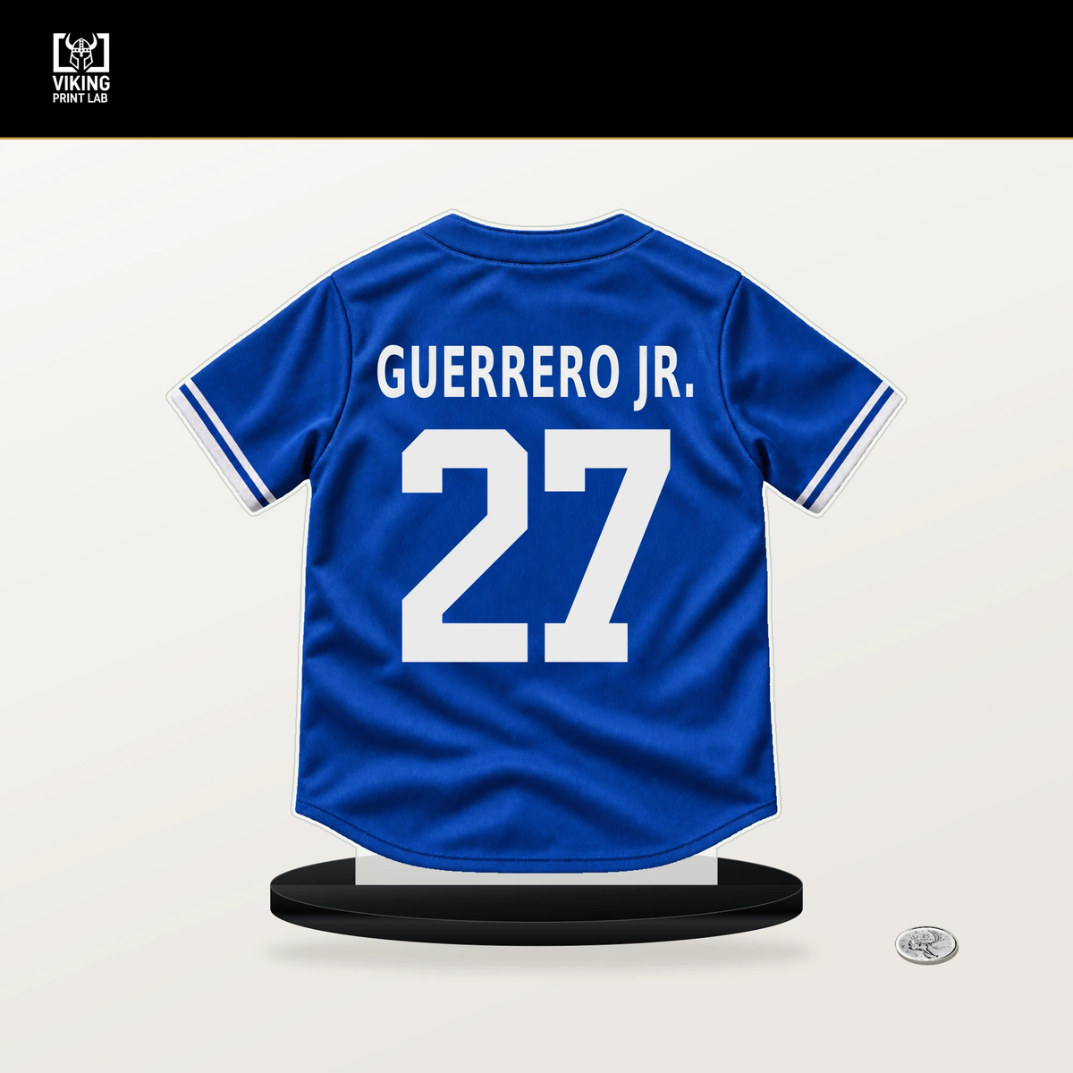 Vladimir Guerrero Jr. number 27 Toronto Blue Jays jersey stand with included black base.