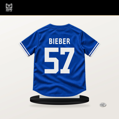 Shane Bieber number 57 Toronto Blue Jays jersey stand with included black base.
