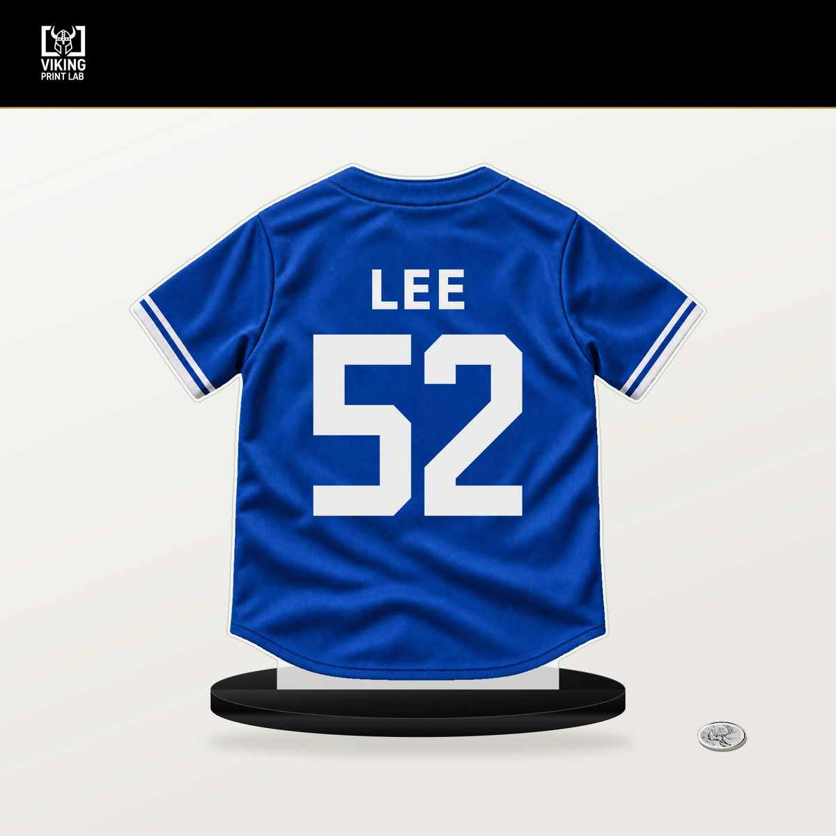 Chase Lee number 52 Toronto Blue Jays jersey stand with included black base.