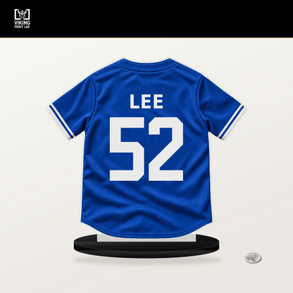 Chase Lee number 52 Toronto Blue Jays jersey stand with included black base.