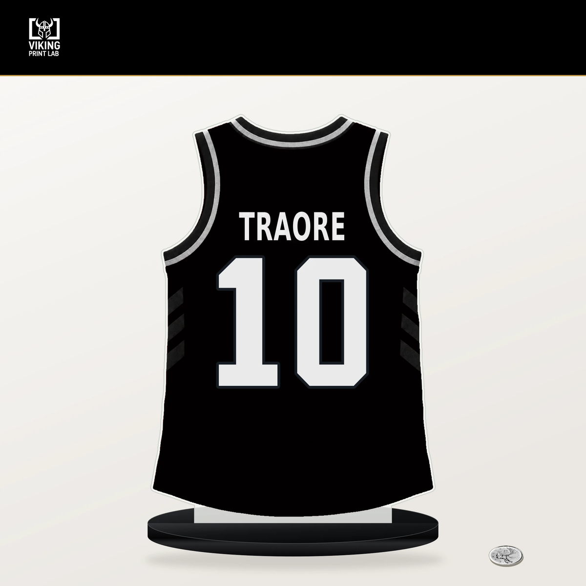 Nolan Traore number 10 Brooklyn Nets jersey stand with included black base.