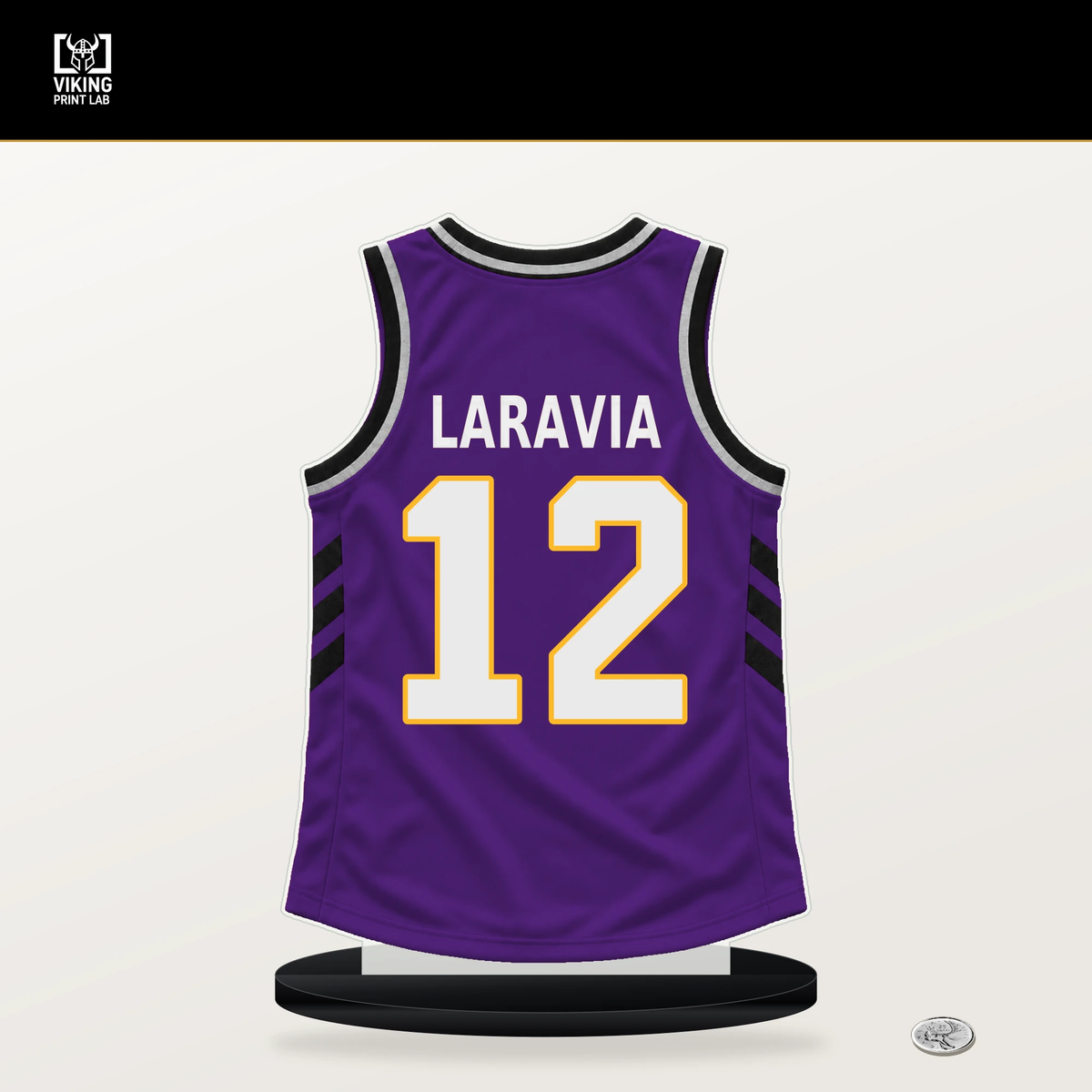 Jake LaRavia number 12 Los Angeles Lakers jersey stand with included black base.