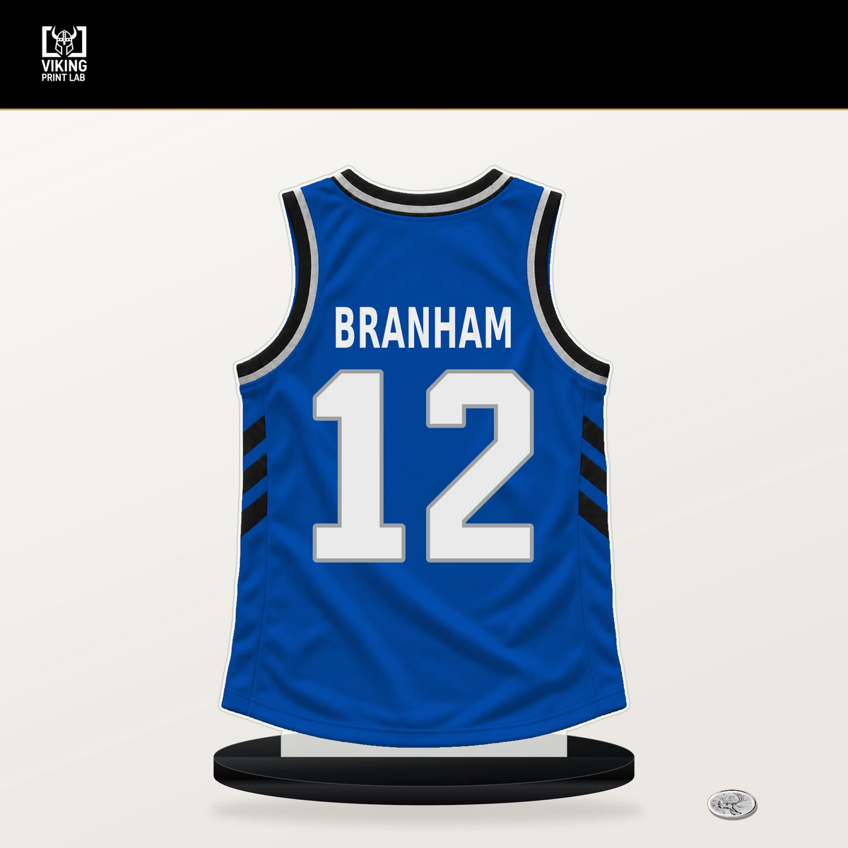 Malaki Branham number 12 Orlando Magic jersey stand with included black base.