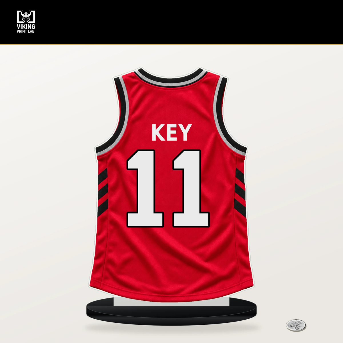 Tyreke Key number 11 Toronto Raptors jersey stand with included black base.