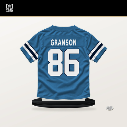 Kylen Granson number 86 Tennessee Titans jersey stand with included black base.
