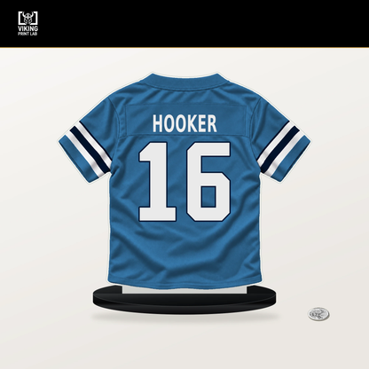 Hendon Hooker number 16 Tennessee Titans jersey stand with included black base.
