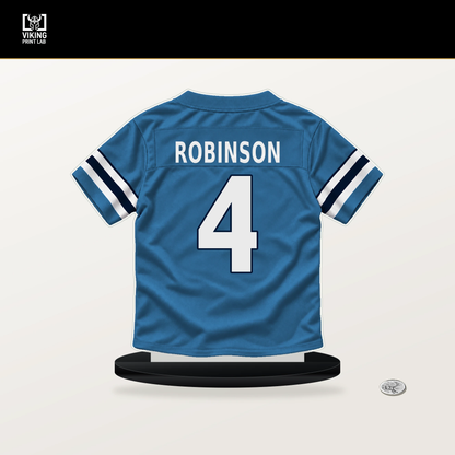 Wan'Dale Robinson number 4 Tennessee Titans jersey stand with included black base.