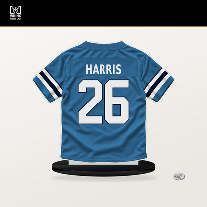 Marcus Harris number 26 Tennessee Titans jersey stand with included black base.