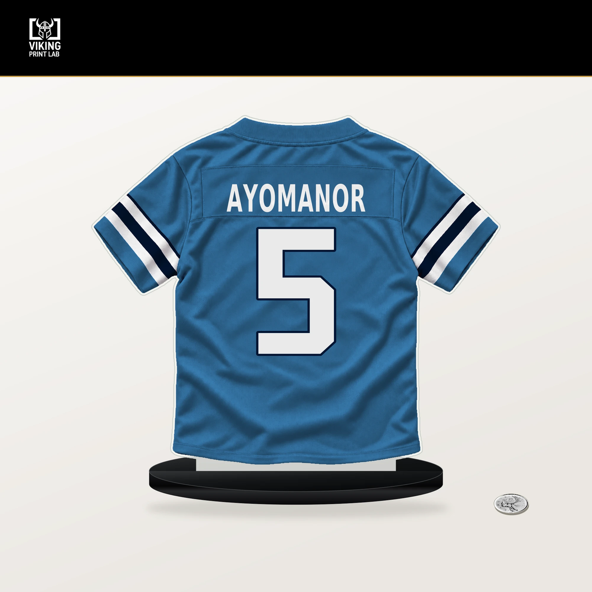 Elic Ayomanor number 5 Tennessee Titans jersey stand with included black base.
