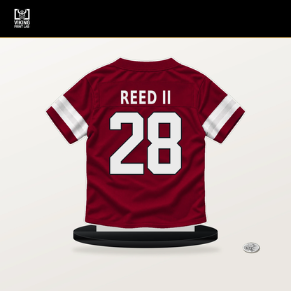 Jerrick Reed II number 28 Arizona Cardinals jersey stand with included black base.