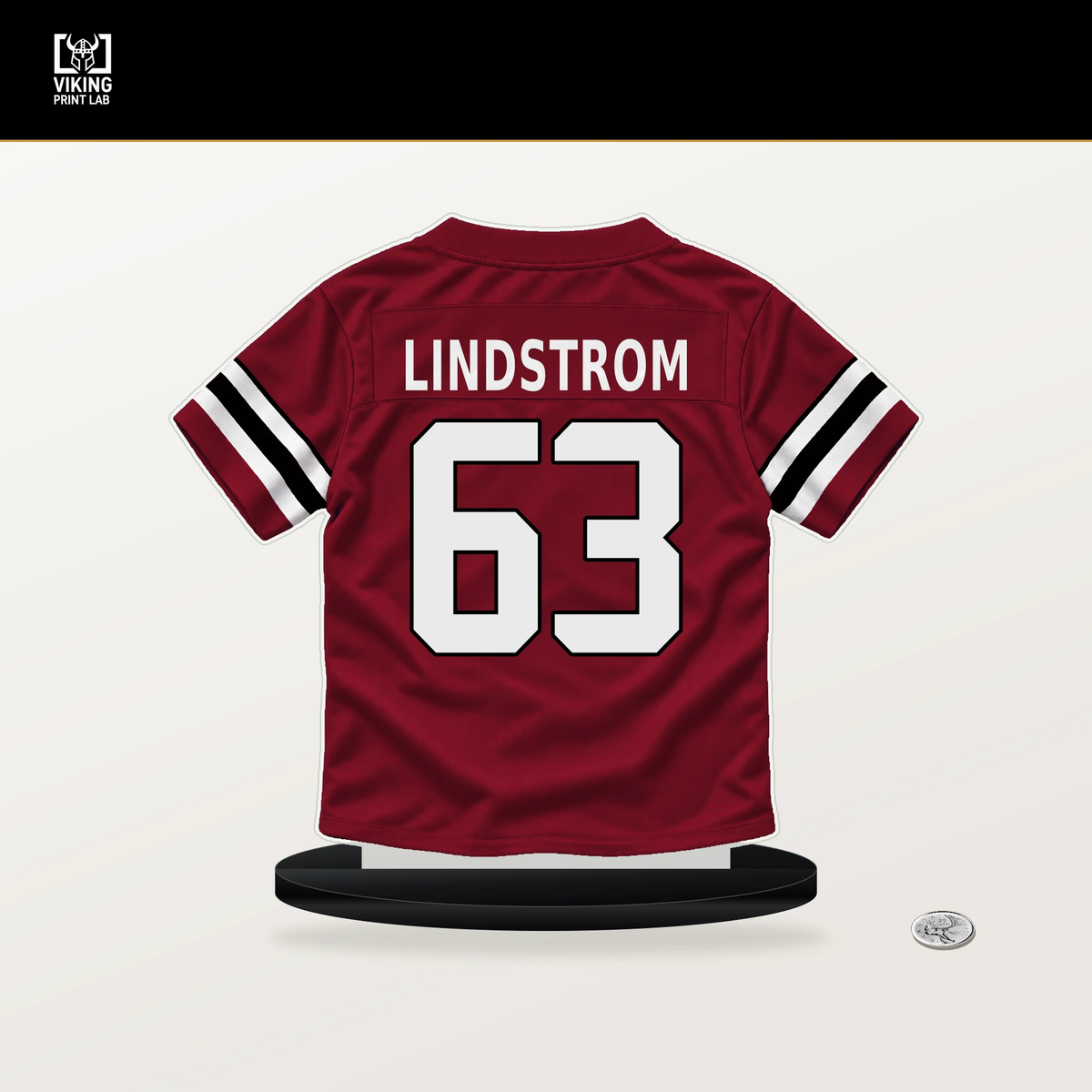 Chris Lindstrom number 63 Atlanta Falcons jersey stand with included black base.