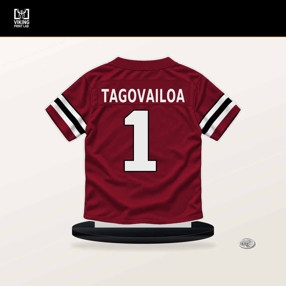 Tua Tagovailoa number 1 Atlanta Falcons jersey stand with included black base.