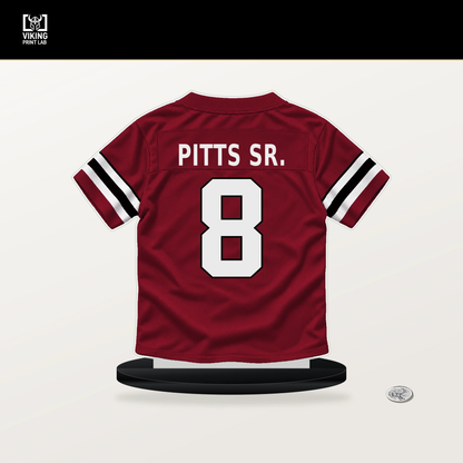 Kyle Pitts Sr. number 8 Atlanta Falcons jersey stand with included black base.