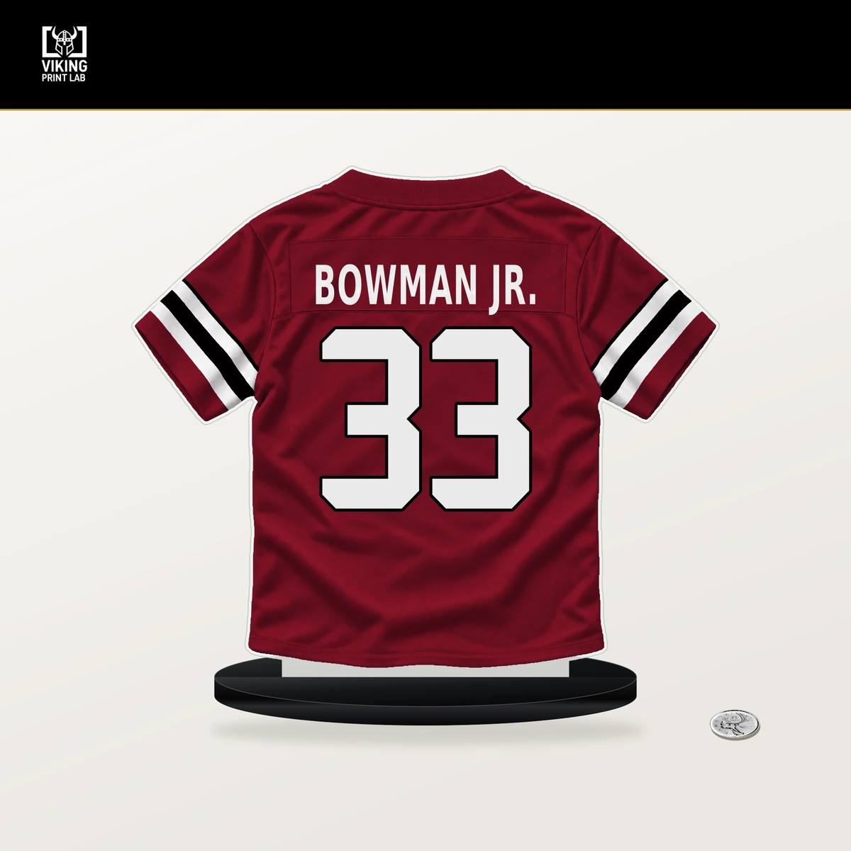 Billy Bowman Jr. number 33 Atlanta Falcons jersey stand with included black base.