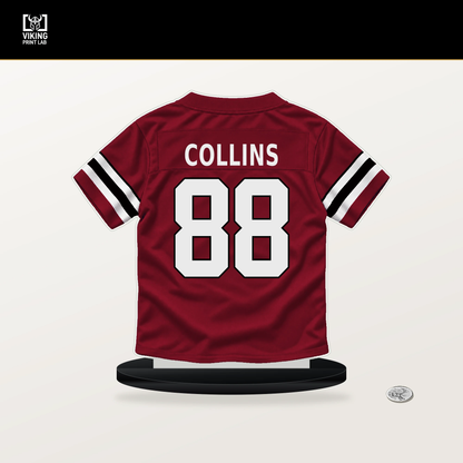 Beaux Collins number 88 Atlanta Falcons jersey stand with included black base.