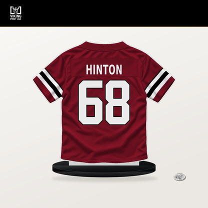 Kyle Hinton number 68 Atlanta Falcons jersey stand with included black base.